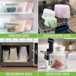 A clear Annaklin 12-pack of reusable silicone food storage bags in various sizes, standing upright.