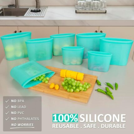 Eight Annaklin aqua silicone food storage bags in various sizes, standing upright with zip-lock closures.