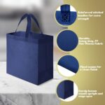 A stack of 100 navy blue reusable non-woven tote bags with handles, neatly folded and ready for use.