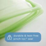 Four clear Stasher reusable silicone bags, including snack, sandwich, 2-cup, and 4-cup sizes, neatly arranged.