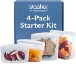 Clear Stasher reusable silicone storage bags in various sizes, including a sandwich bag, snack bag, stand-up mid bag, and a b